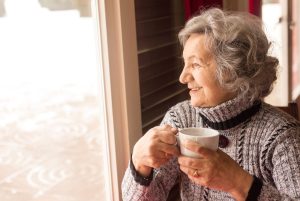 elderly woman drinking coffee