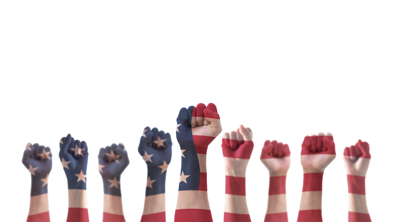 Labor day celebration concept with USA national flag on American people clenched fist hand isolated with clipping path for United States of America happy national holiday.