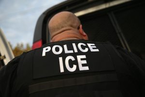 LOS ANGELES, CA - OCTOBER 14: U.S. Immigration and Customs Enforcement (ICE), agents detain an immigrant on October 14, 2015 in Los Angeles, California. ICE agents said the immigrant, a legal resident with a Green Card, was a convicted criminal and member of the Alabama Street Gang in the Canoga Park area. ICE builds deportation cases against thousands of immigrants living in the United States. Green Card holders are also vulnerable to deportation if convicted of certain crimes. The number of ICE detentions and deportations from California has dropped since the state passed the Trust Act in October 2013, which set limits on California state law enforcement cooperation with federal immigration authorities. (Photo by John Moore/Getty Images)
