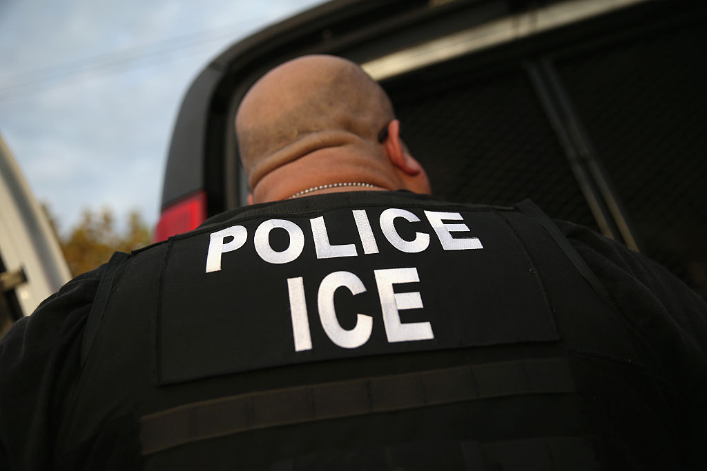LOS ANGELES, CA - OCTOBER 14: U.S. Immigration and Customs Enforcement (ICE), agents detain an immigrant on October 14, 2015 in Los Angeles, California. ICE agents said the immigrant, a legal resident with a Green Card, was a convicted criminal and member of the Alabama Street Gang in the Canoga Park area. ICE builds deportation cases against thousands of immigrants living in the United States. Green Card holders are also vulnerable to deportation if convicted of certain crimes. The number of ICE detentions and deportations from California has dropped since the state passed the Trust Act in October 2013, which set limits on California state law enforcement cooperation with federal immigration authorities. (Photo by John Moore/Getty Images)