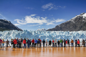 Tour group looking at glacier. Cruise Alaska