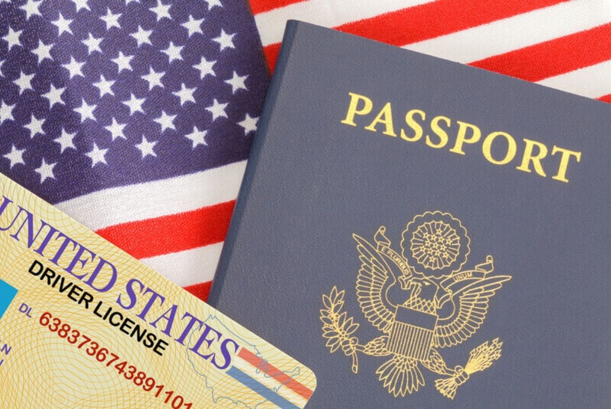 Passport License Flag. American Passport Close Up With Drivers License on Top of USA Flag.