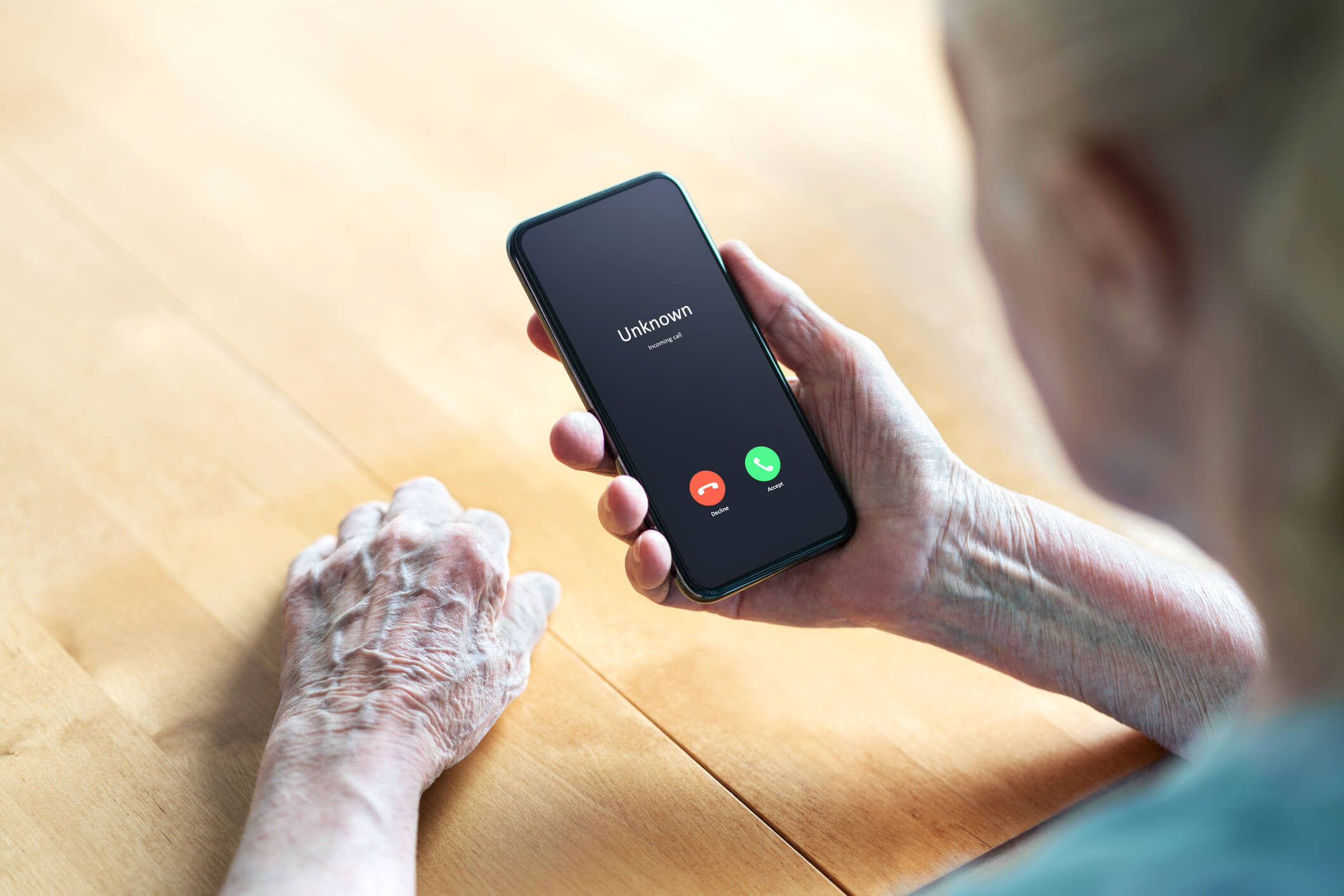 Phone call to old woman from scam or fraud caller. Elder senior answering to unknown number. Smartphone scammer or mobile hoax. Smartphone scammer or mobile hoax, catfish or phishing concept. Stalker or stranger. Grandma with cellphone.