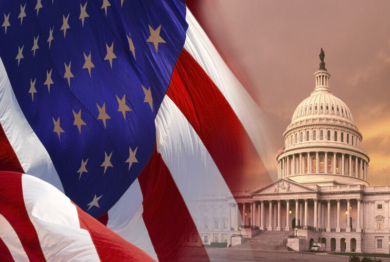 Capitol Building - Washington DC. The Capitol Building in Washington DC with the flag of the United States of America.