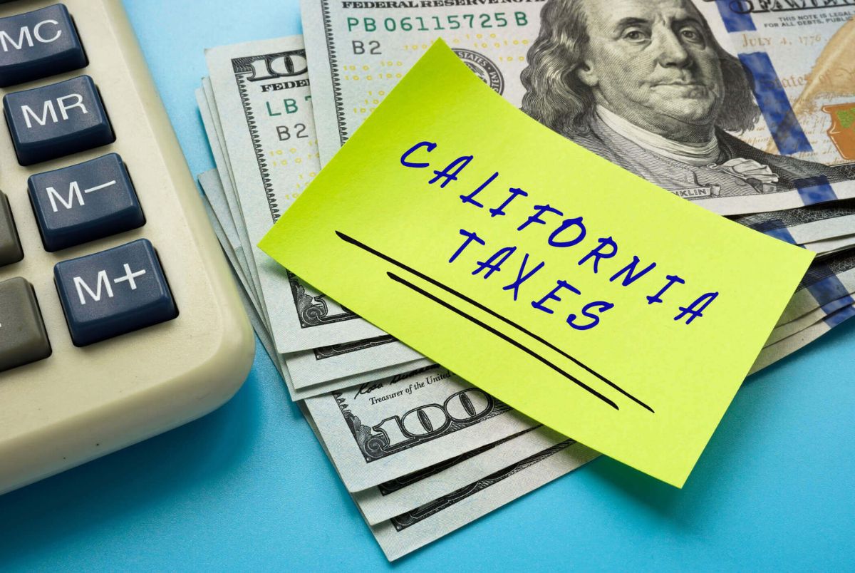 Business concept meaning CALIFORNIA TAXES with sign on the page.