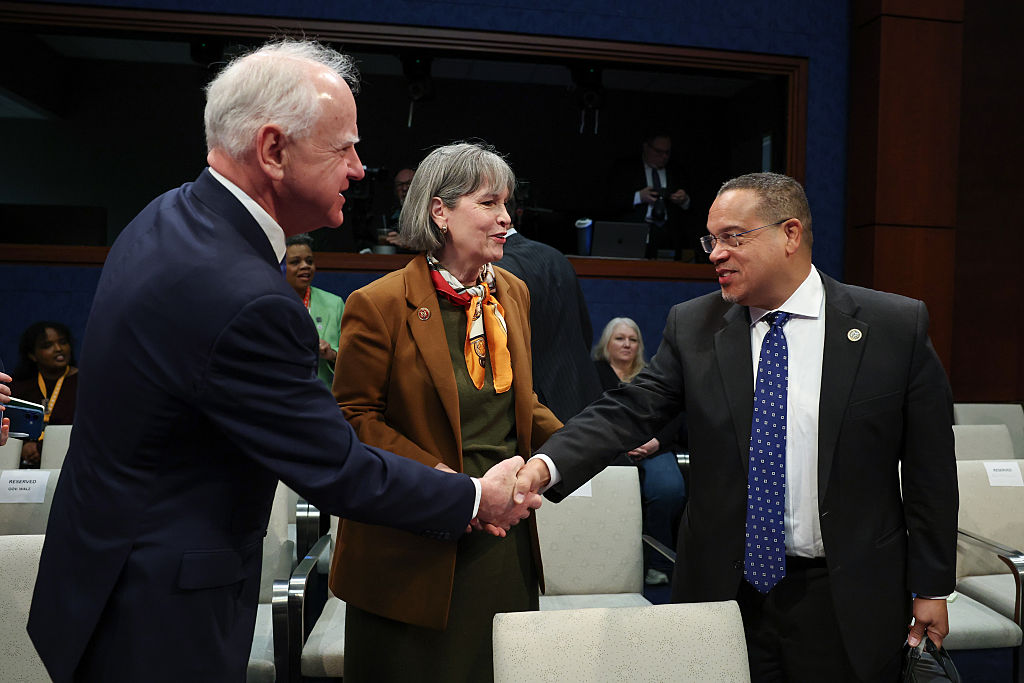 Minnesota Gov. Tim Walz (L) greets Minnesota Attorney General Keith Ellison (R) as they arrive to testify during a House Oversight and Government Reform Committee hearing as U.S. Rep. Betty McCollum (D-MN) (C) looks on in the U.S. Capitol Building on March 04, 2026 in Washington, DC.