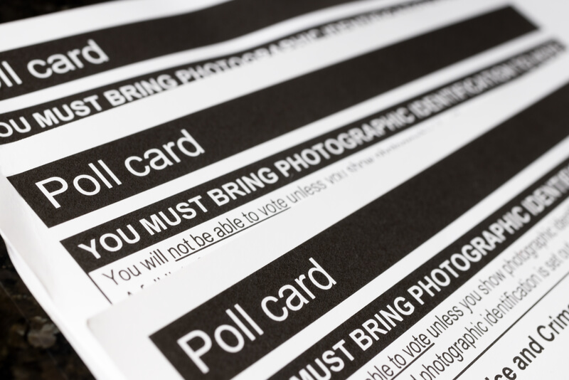British Poll Cards for Voting in UK or United Kingdom Elections. British voter id poll cards for voting in United Kingdom local and national government elections showing the need for photographic identification