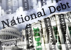 Capitol in Washington DC and National Debt text. The US Capitol in Washington with National Debt text and hundred dollar bills