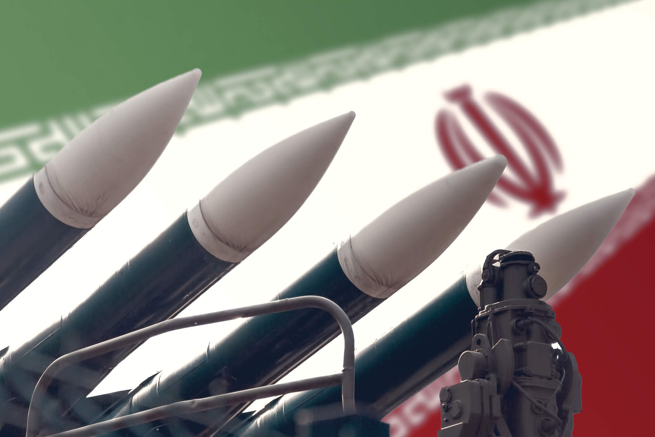 Cruise missiles on the background of the flag of Iran. The concept of a military conflict in the Persian Gulf. The threat of war