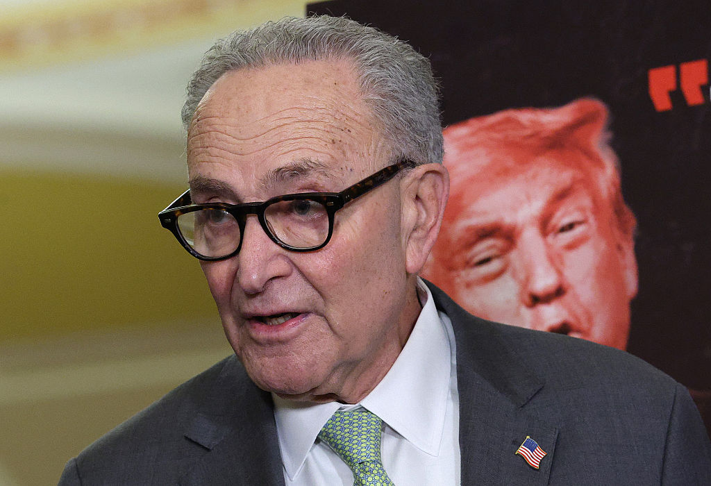 U.S. Senate Minority Leader Chuck Schumer (D-NY) speaks alongside a poster of President Donald Trump following the weekly Senate Democrat policy luncheon at the U.S. Capitol on March 03, 2026 in Washington, DC.