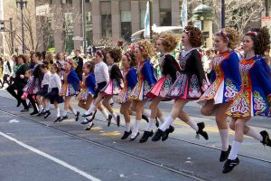 Irish dancers performing in a St. Patrick's Day parade.