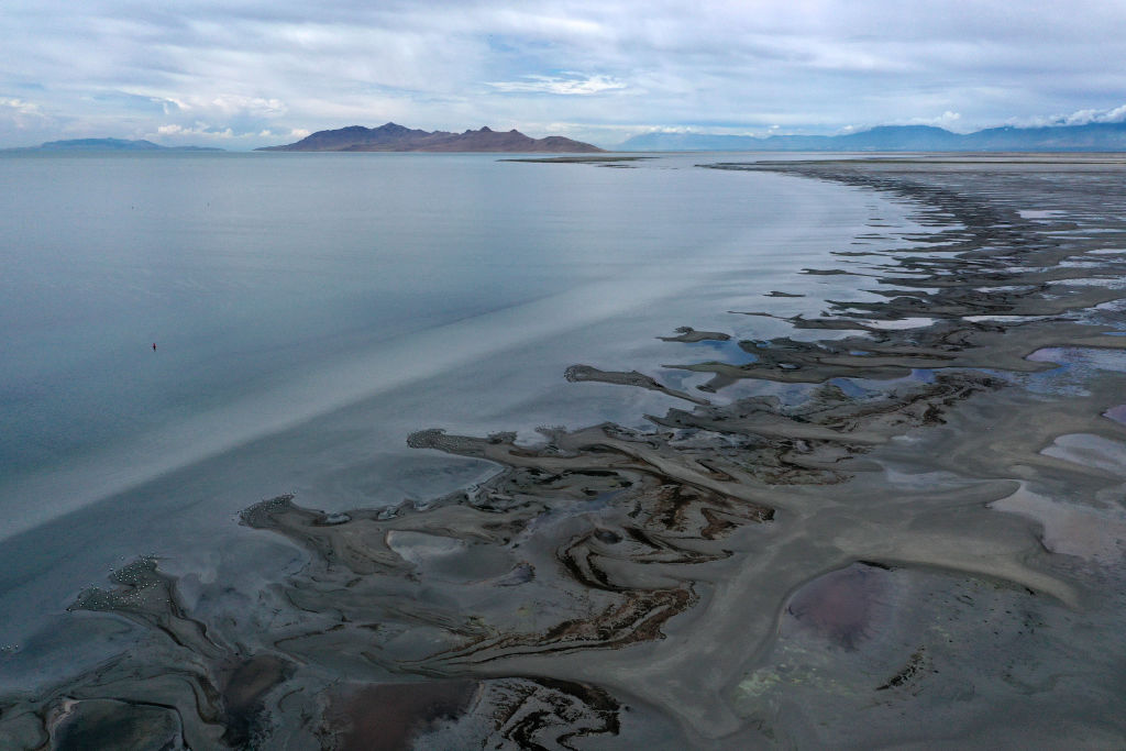 MAGNA, UTAH - AUGUST 02: In an aerial view, low water levels are visible at the Great Salt Lake on August 02, 2021 near Magna, Utah. As severe drought continues to take hold in the western United States, water levels at the Great Salt Lake, the largest saltwater lake in the Western Hemisphere, have dropped to the lowest levels ever recorded. The lake fell below 4194.4 feet in the past week after years of decline from its highest level recorded in 1986 with 4211.65 feet. Further decline of the lake's water levels could result in an increase in water salinity and could generate dust from the exposed lakebed that could impact air quality in the area. The lake does not supply water or generate electricity for nearby communities but it does provide a natural habitat for migrating birds and other wildlife. According to the U.S. Drought Monitor, 99 percent of Utah is experiencing extreme drought conditions. (Photo by Justin Sullivan/Getty Images)
