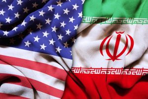 Closeup of USA and Iran silk flags in the studio. Conflict concept.