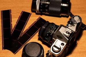 An old school camera with film.