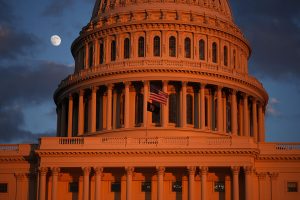 WASHINGTON, DC - DECEMBER 02: The moon is visible behind the U.S. Capitol prior to the U.S. Capitol Christmas Tree lighting ceremony on December 02, 2025 in Washington, DC. This year’s tree, a 53-foot red fir from the Humboldt-Toiyabe National Forest, marks the first U.S. Capitol Christmas Tree from the state of Nevada. (Photo by Andrew Harnik/Getty Images)