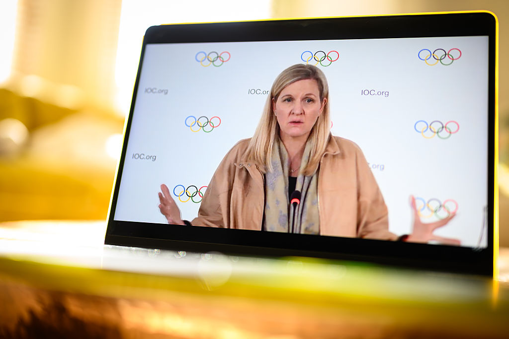 In this photo illustration, IOC President Kirsty Coventry is seen on a computer screen as she speaks at a live-streamed press briefing from Lausanne, Switzerland about the newly announced ban on transgender athletes in women's events on March 26, 2026 as viewed in London, United Kingdom.