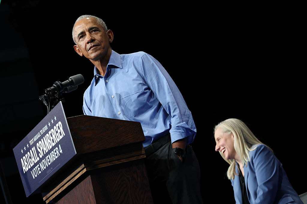 NORFOLK, VIRGINIA - NOVEMBER 01: Former U.S .President Barack Obama speaks as Virginia Democratic gubernatorial candidate, former Rep. Abigail Spanberger (R) sits next to him during a campaign rally in the Chartway Arena on November 01, 2025 in Norfolk, Virginia. Spanberger will face off against Republican candidate Winsome Earle-Sears in the Commonwealth of Virginia’s off-year election for governor and other statewide offices on November 4. (Photo by Win McNamee/Getty Images)