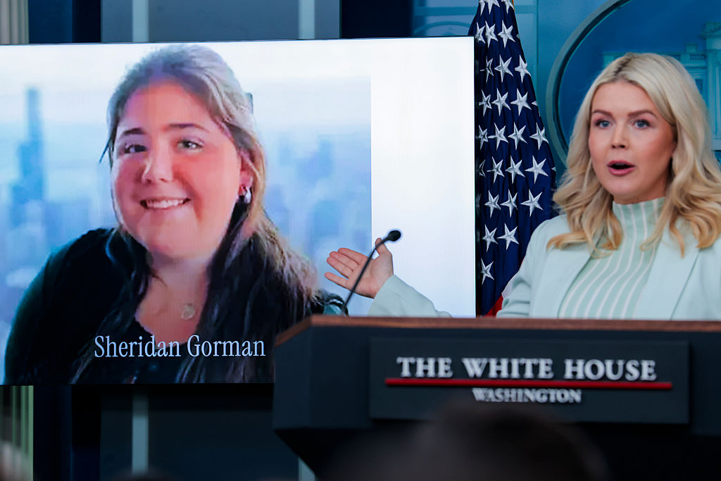 WASHINGTON, DC - MARCH 25: White House Press Secretary Karoline Leavitt speaks alongside a photo of Sheridan Gorman, an 18-year-old college student who was killed in Chicago, during a news briefing in the James S. Brady Press Briefing Room of the White House on March 25, 2026 in Washington, DC. Leavitt discussed a range of topics including the partial government shutdown impacting the Department of Homeland Security which has entered its 40th day. (Photo by Heather Diehl/Getty Images)