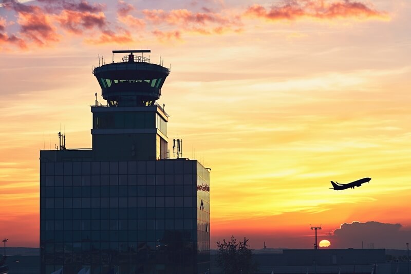 Air Traffic Control Tower at the airport during amazing sunset