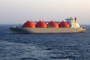 Oil and gas industry - LNG tanker. LNG carrier ship designed for transporting natural gas anchored