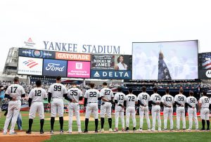 The New York Yankees and the Miami Marlins line up for the national anthem before the home opener at Yankee Stadium on April 03, 2026 in the Bronx borough of New York City.