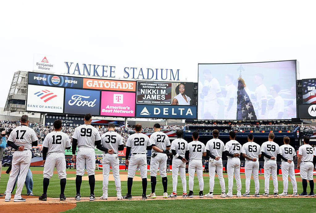 The New York Yankees and the Miami Marlins line up for the national anthem before the home opener at Yankee Stadium on April 03, 2026 in the Bronx borough of New York City.