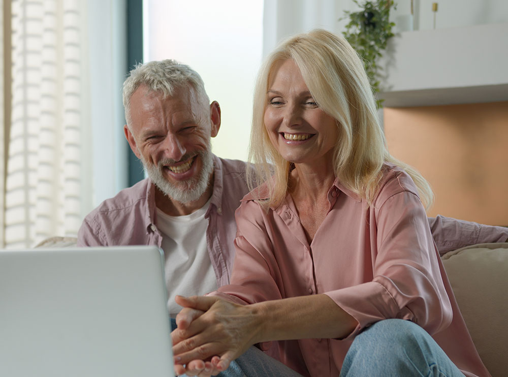 A senior couple reviewing their Social Security options