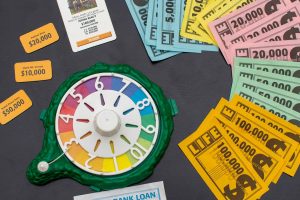 A board game spinner and associated components from The Game of Life board game.