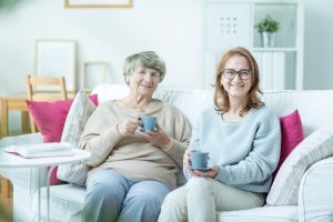 Woman with elderly mother. Middle-aged women spending time with her elderly mother
