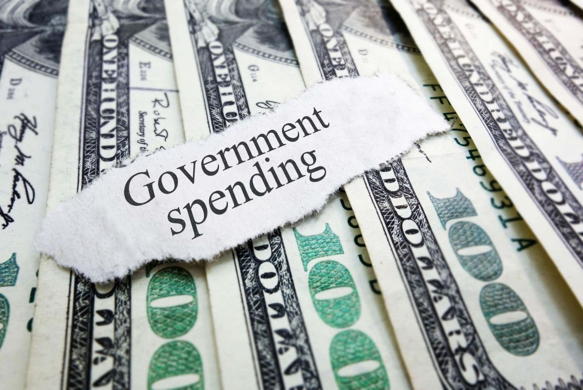 Government Spending newspaper headline on assorted money
