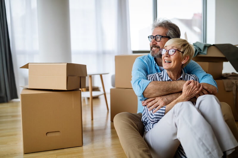 Portrait of happy smiling senior couple in love moving in new home