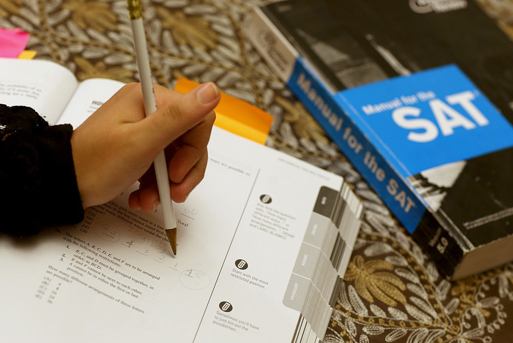 PEMBROKE PINES, FL - MARCH 06: Suzane Nazir uses a Princeton Review SAT Preparation book to study for the test on March 6, 2014 in Pembroke Pines, Florida. Yesterday, the College Board announced the second redesign of the SAT this century, it is scheduled to take effect in early 2016. (Photo by Joe Raedle/Getty Images)