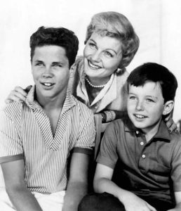 This photo features actors from the classic American sitcom Leave It to Beaver.