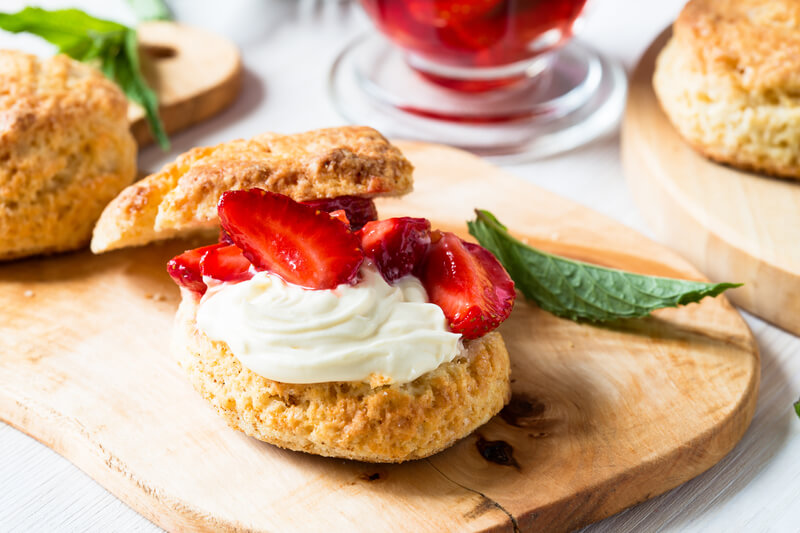 Strawberry shortcake with cream. Homemade strawberry shortcake with vanilla whipped cream and berry compote