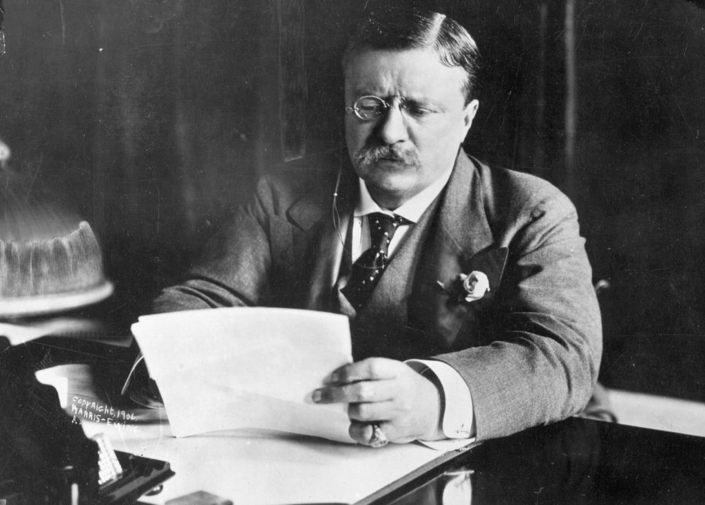 circa 1905: Theodore Roosevelt (1858 - 1919),the 26th President of the United States (1901-09) sitting at his desk working. (Photo by Hulton Archive/Getty Images)