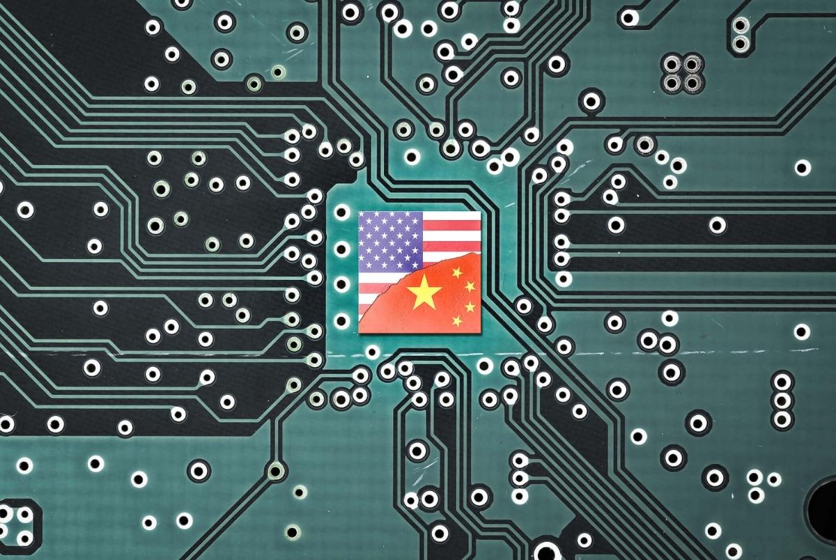 Tech war between China and the USA. Flag of USA and China on a microprocessor. Flag of USA and China on a microprocessor, CPU or GPU microchip on a motherboard. symbolizing war the United States and China tech war. US limits, restricts AI chips sales to China.