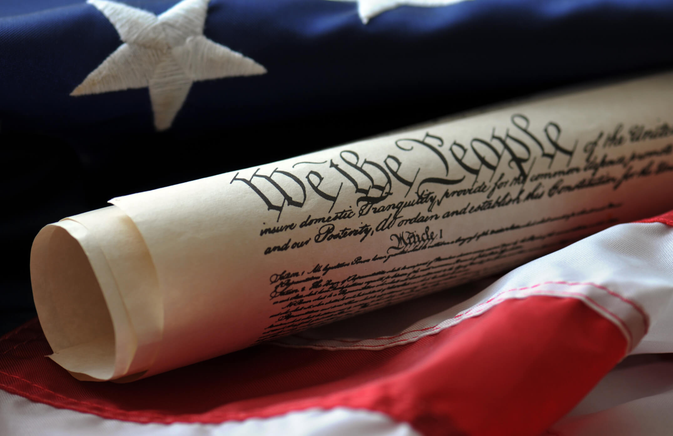 We The People. US Constitution preamble and US flag