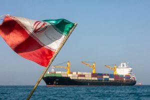 STRAIT OF HORMUZ, IRAN - MAY 16: An Iranian flag flutters in the wind as ships remain anchored on May 16, 2026 in the Strait of Hormuz near Larak Island, Iran. Negotiations between the U.S. and Iran over opening this critical waterway have largely stalled as the countries have rejected each other's proposals to end the war that began when the U.S. and Israel attacked Iran on February 28. (Photo by Majid Saeedi/Getty Images)
