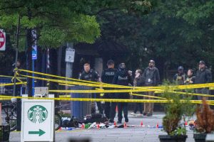 Emergency teams work the scene after multiple rapid-fire gunshots ring out near the White House on May 23, 2026 in Washington, DC.