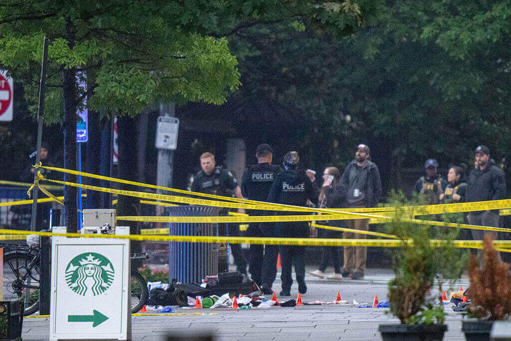 Emergency teams work the scene after multiple rapid-fire gunshots ring out near the White House on May 23, 2026 in Washington, DC.
