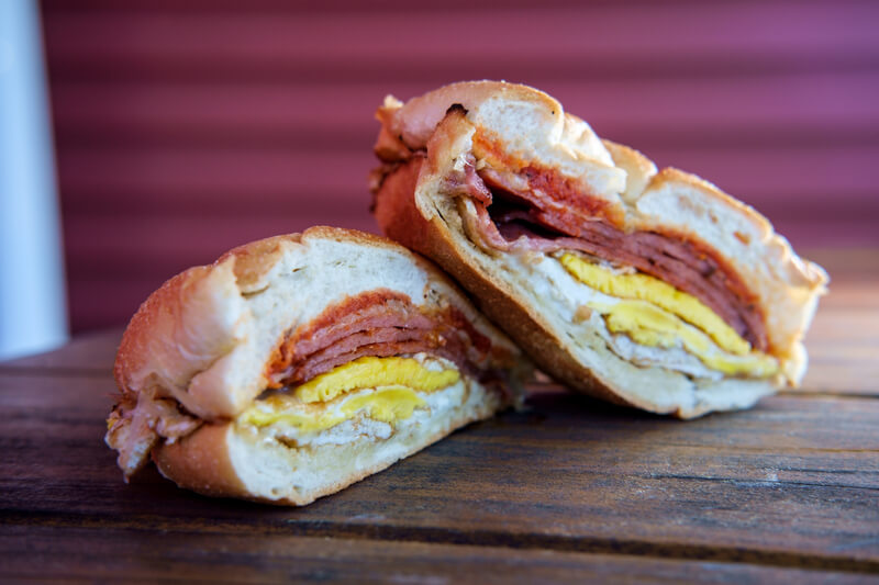 Taylor Ham Egg Cheese. Taylor ham, pork roll, egg and cheese breakfast sandwich on a kaiser roll with salt pepper and ketchup from New Jersey