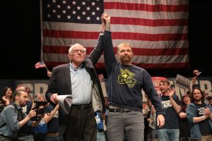 Sen. Bernie Sanders (I-VT) and Democratic U.S. Senate candidate Graham Platner stand together during a “Fighting Oligarchy” tour stop at the Collins Center for the Arts on the University of Maine campus on May 24, 2026 in Orono, Maine.