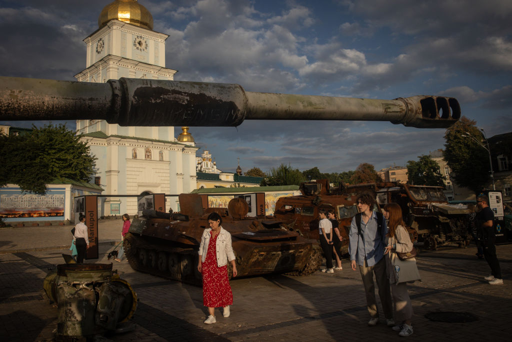 People look at destroyed tanks and military vehicles displayed in a square in front of St. Michael's Golden-Domed Monastery on September 21, 2023 in Kyiv, Ukraine.