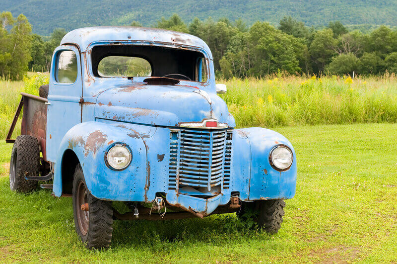 Old abandoned truck. Old abandoned farm truck in a rural country field.