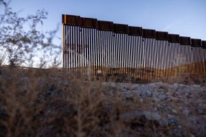 The U.S.-Mexico border fence ends with a gap on January 20, 2025 east of Sasabe, Arizona. Nightly, immigrants pass around the fence after smugglers transport them to the remote area in the Sonora Desert.