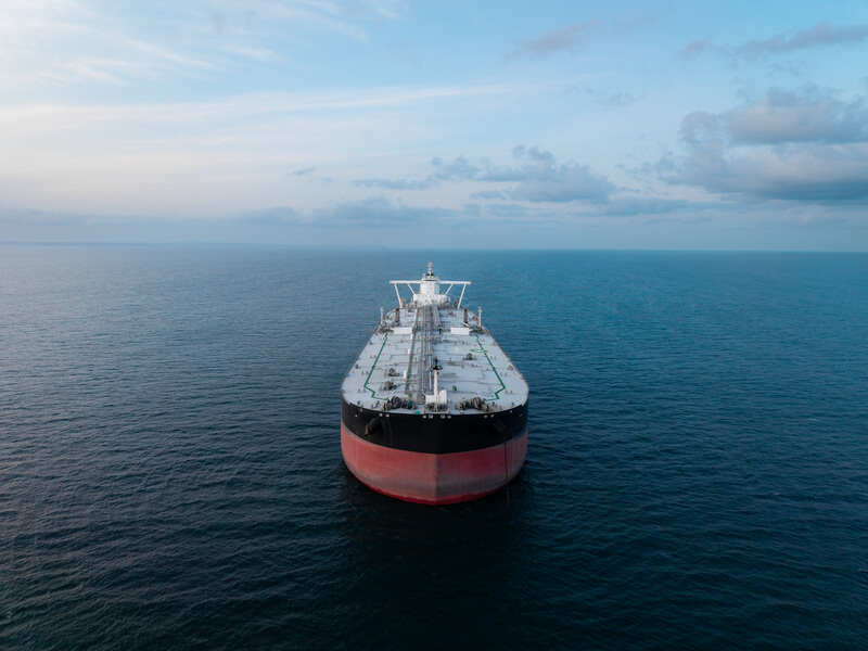Aerial view of the front of a large crude oil tanker ship at sea. Aerial view above a large crude oil product tanker ship on the high seas in the Strait Of Hormuz transporting oil and petroleum products around the world
