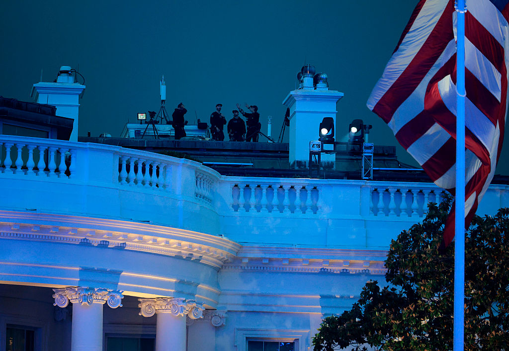 President Trump Hosts UFC Freedom 250 Fight Topuria v Gaethje At The White House WASHINGTON, DC - JUNE 14: U.S. Secret Service agents are seen atop the White House during UFC Freedom 250 on the South Lawn on June 14, 2026 in Washington, DC. President Trump is hosting a series of Ultimate Fighting Championship matches on his 80th birthday, which the White House is calling "a once-in-a-generation celebration of the American fighting spirit.” (Photo by Chip Somodevilla/Getty Images)