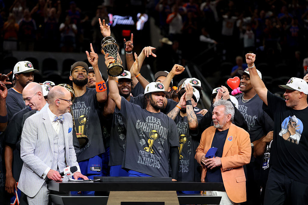 Jalen Brunson #11 of the New York Knicks lifts the Bill Russell NBA Finals Most Valuable Player Award trophy after defeating the San Antonio Spurs in Game Five of the 2026 NBA Finals at Frost Bank Center on June 13, 2026 in San Antonio, Texas.