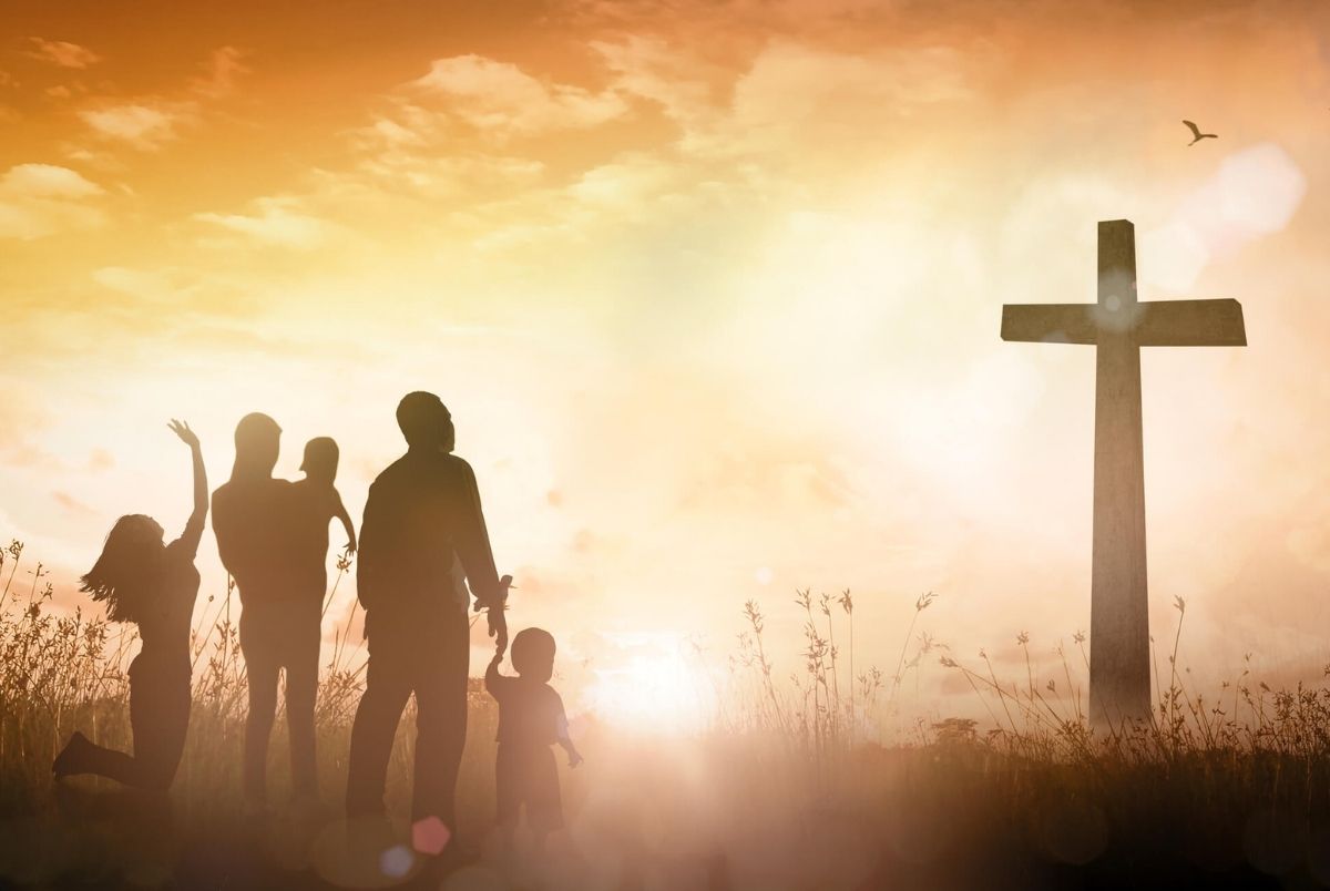 Christian Family Worship at Sunset Cross for Faith and Praise Banner. A powerful silhouette of a Christian family? parents and children? raised in worship and praise before a large wooden cross at sunset. This atmospheric scene symbolizes the "Family of God," spiritual unity, and the "Holy Spirit" presence. The glowing sunrise and birds in flight represent hope, gratitude, and the "Truth" of the gospel. Perfectly suited for church service banners, Easter programs, Bible teaching materials, and family-oriented religious content. It captures the heart of communal worship, giving thanks, and the foundation of a faith-based household.
