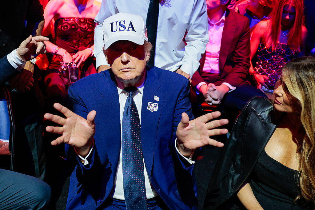 U.S. President Donald Trump gestures next to first lady Melania Trump during UFC Freedom 250 on the South Lawn of the White House on June 15, 2026 in Washington, DC.